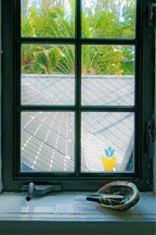 photovoltaic panels hidden within roof of the Chael-Dover Cottage in Miami, Florida