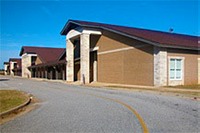 Pine Level Elementary School front doors viewed from "stack lanes" which resemble a racetrack