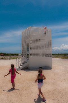 children playing on and around observation tower at Schooner Bay, Bahamas