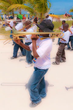 trombone players in marching band composed of local children at the first Schooner Springfest in 2011, Schooner Bay, Bahamas