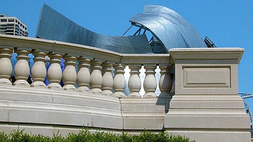 Frank Gehry bandshell behind classical balustrade at Millennium Park in Chicago