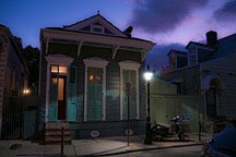 French Quarter shotgun cottage at nightfall
