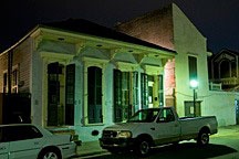 double shotgun cottage in New Orleans French Quarter at night
