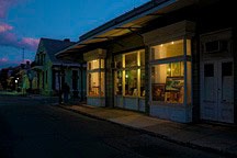 double bay storefront in New Orleans French Quarter at dusk