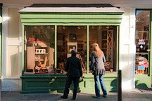 green storefront window in New Orleans French Quarter